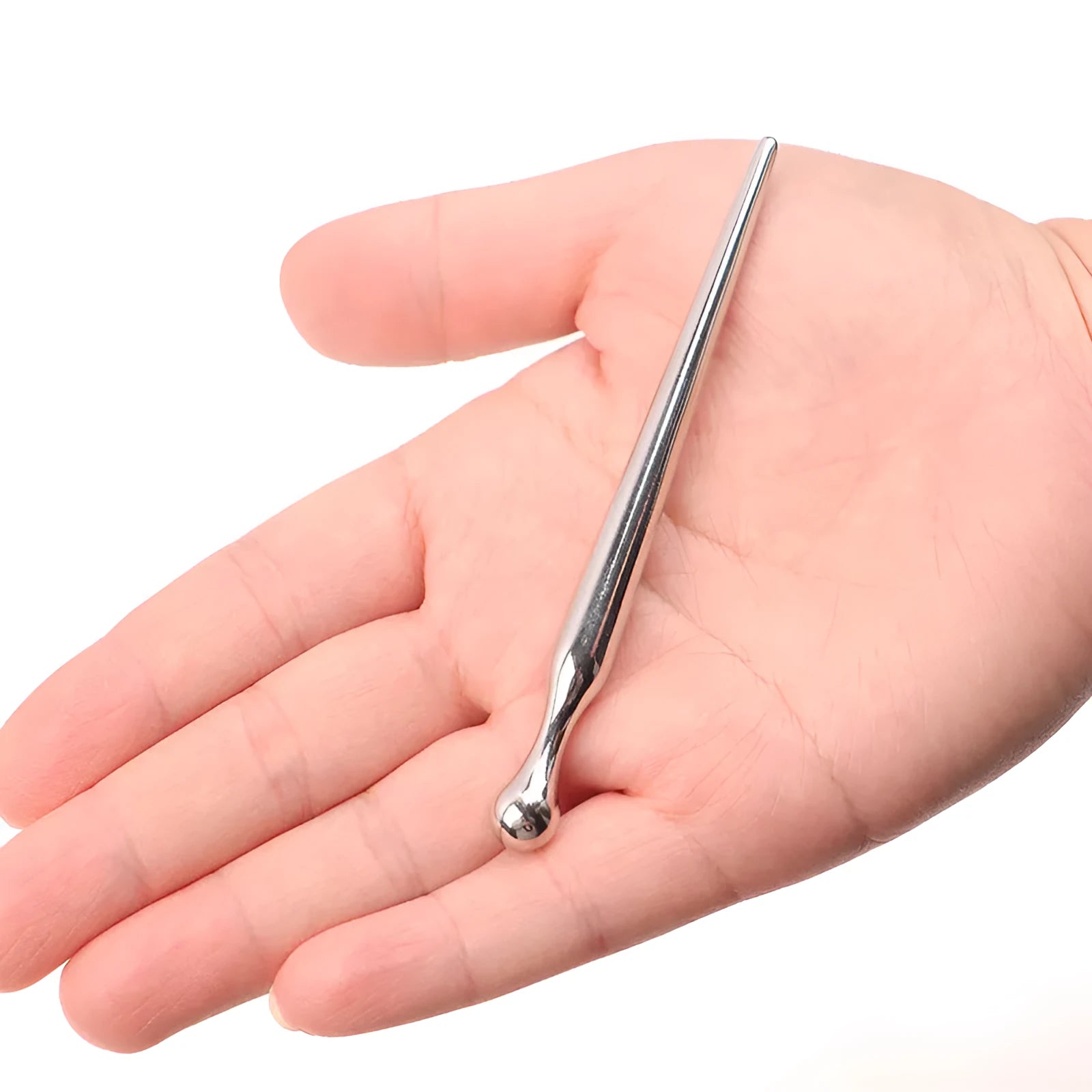 Silver metal urethral stimulation stick with round beads on a plain background