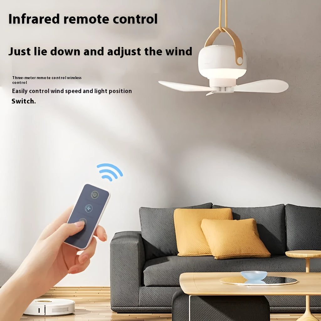 Rechargeable portable camping fan with night light, remote control, and hanging bracket on a blue background.