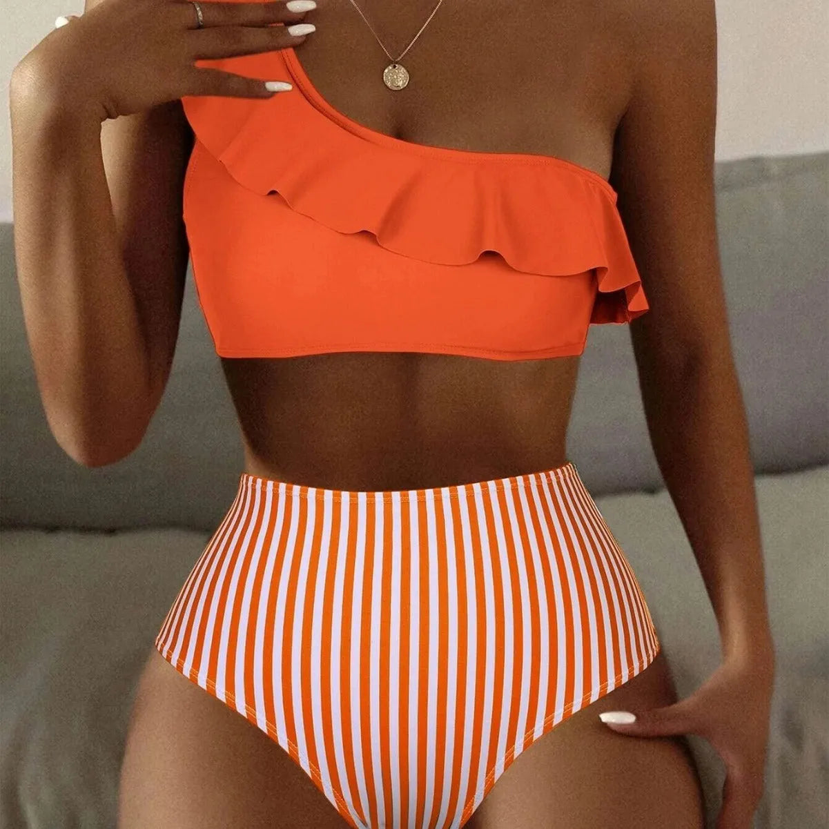 Women's striped and solid colour split design bikini swimsuit shown in multiple colour options.