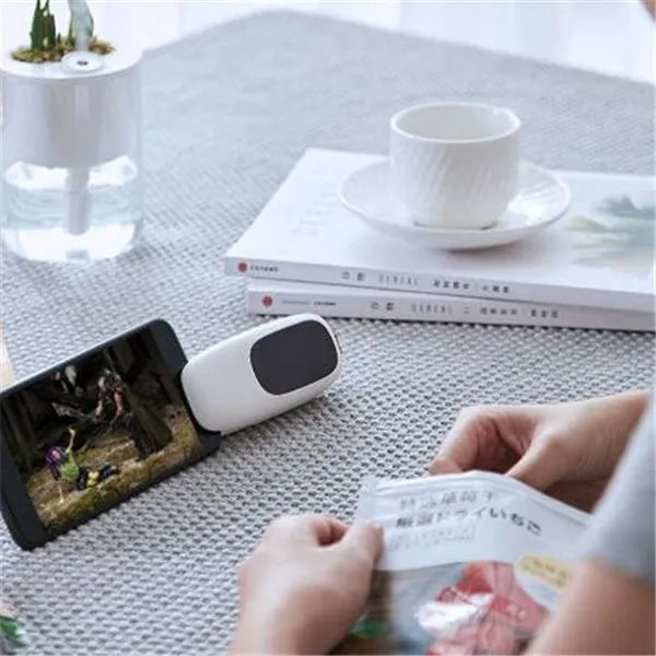 Mini hand pressure heat sealing machine in blue on white background, 10cm long ABS and metal body