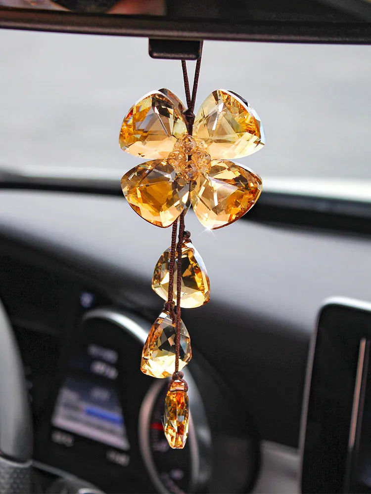 Crystal Four Leaf Grass car interior hanging pendant approximately 20cm long on a clear background.