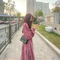 Red knitted cotton midi dress with elastic waist and 3/4 princess sleeves.