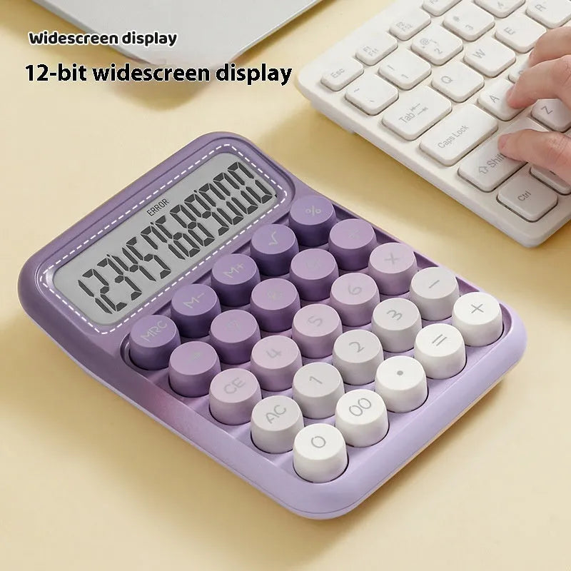 Round gradient colour mechanical keyboard calculator in mute blue, green, pink, or purple on a desk.