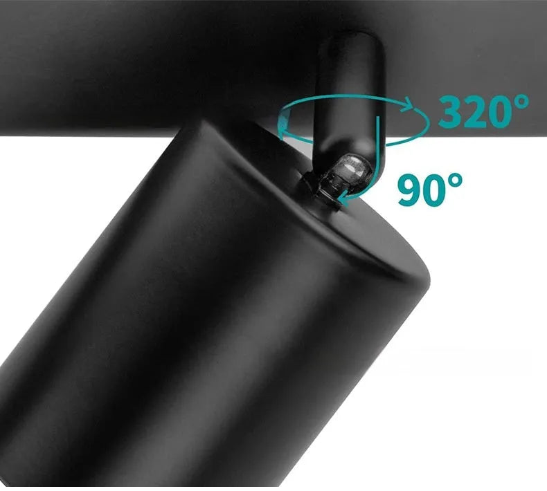 Three-head adjustable aluminium ceiling spotlight in black finish, angled for TV wall lighting