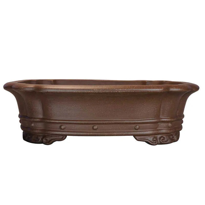 Purple sand clay handmade rectangular antique begonia flower pot on a desktop.