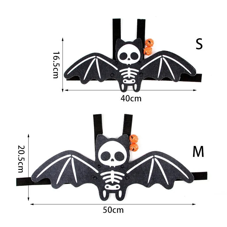 Halloween costume for a cat shaped like black bat wings, shown in orange pumpkin variant.