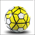 UEFA Champions League PU leather football in multi-colour design with white panels and red accents on grass