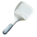 White plastic cat litter scoop with storage base for containing tool between uses