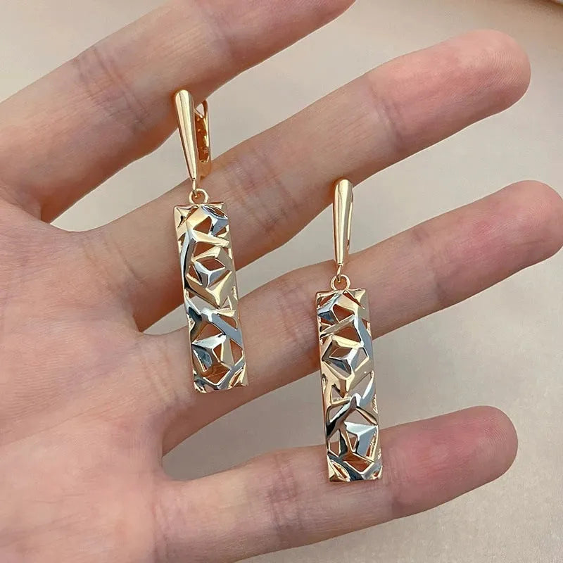 Rectangular two-tone hollow stud earrings with electroplated finish and geometric design