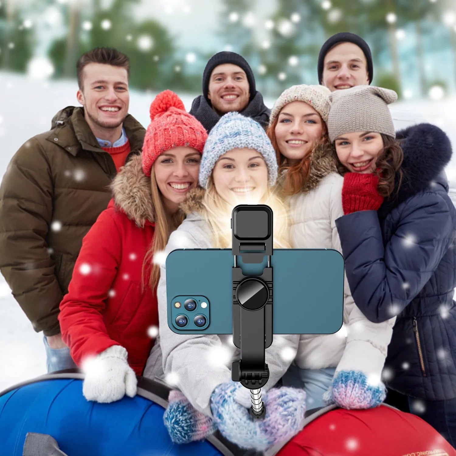 Portable retractable selfie stick tripod with Bluetooth remote and stainless steel shaft in black on a flat surface