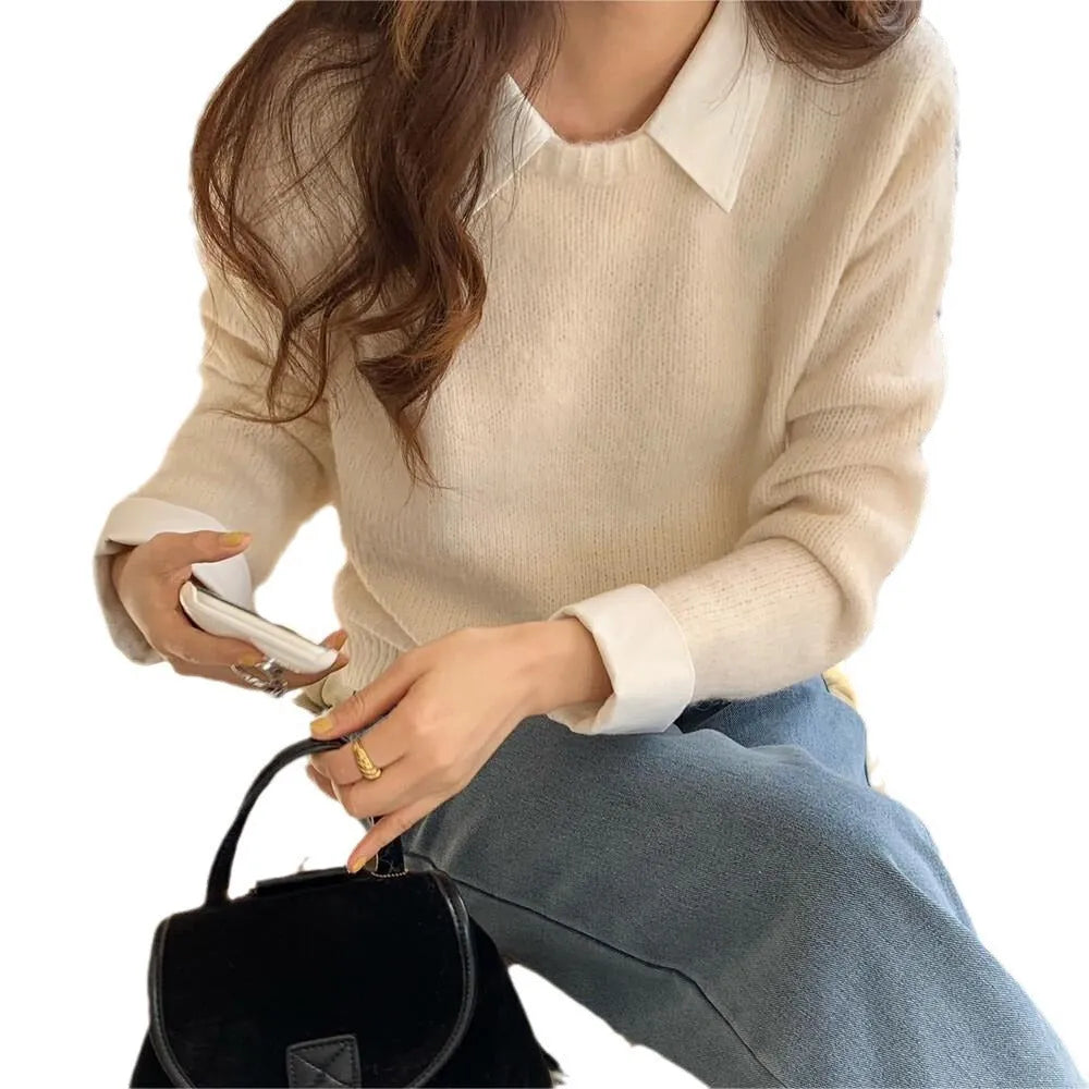 Women's loose-fit knit top with contrast lapels in navy blue, showing front design.