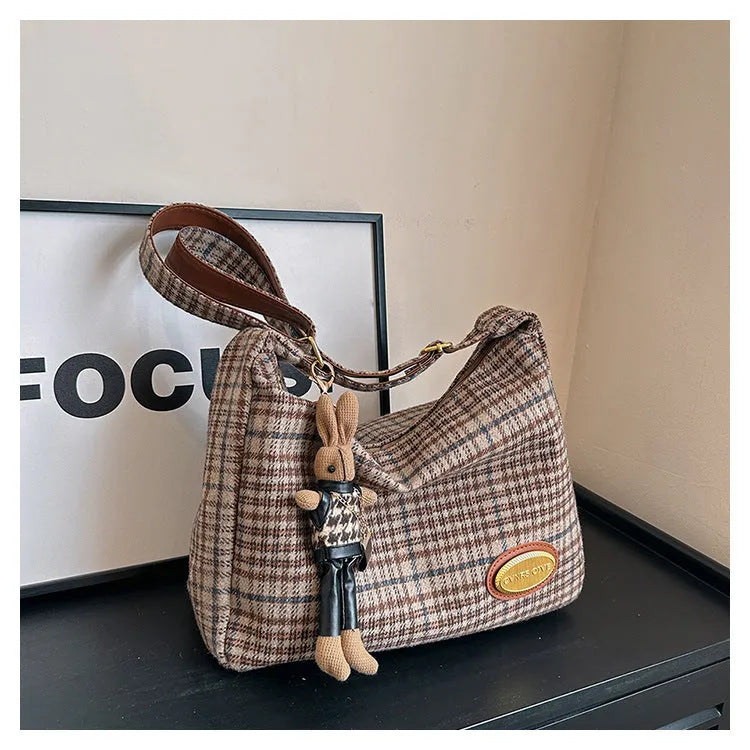 Women's large soft woolen cross-body shoulder bag in a horizontal square shape, shown in a choice of colours.