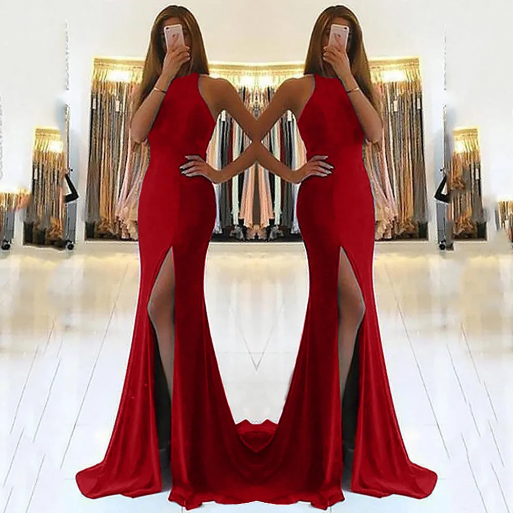 Long red ladies evening dress with large swing skirt, hanging neckline, and hollow detail on a mannequin