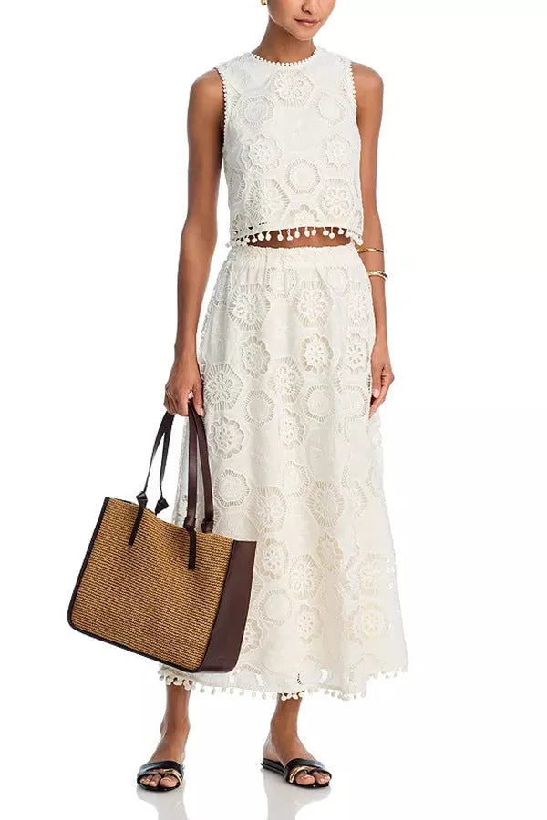 Literary Trends white women's suit with embroidered detail on sleeveless top and long skirt