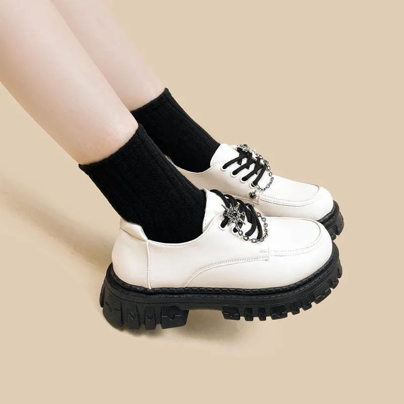 Women's preppy style loafers in Duke Asterism colour with a cross strap and metal buckle.
