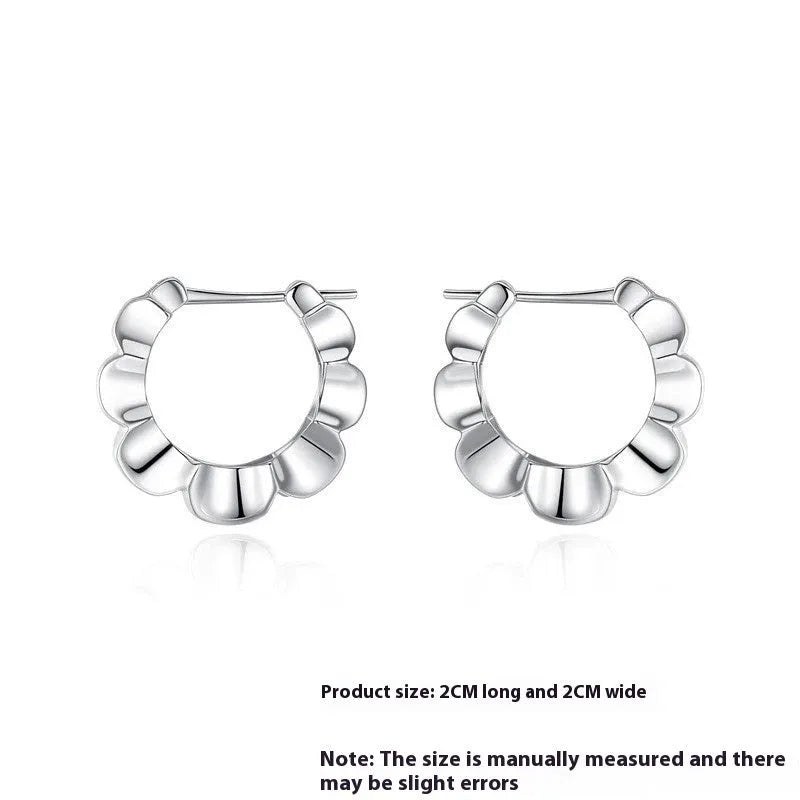 Silver geometric earrings with electroplated finish and circular design elements
