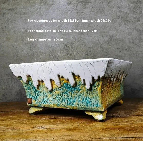 White glazed Lingnan Shiwan ceramic flowerpot on surface