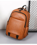 Men's large capacity PU backpack in khaki, 47x33x18cm, with curved shoulder straps and main compartment opening