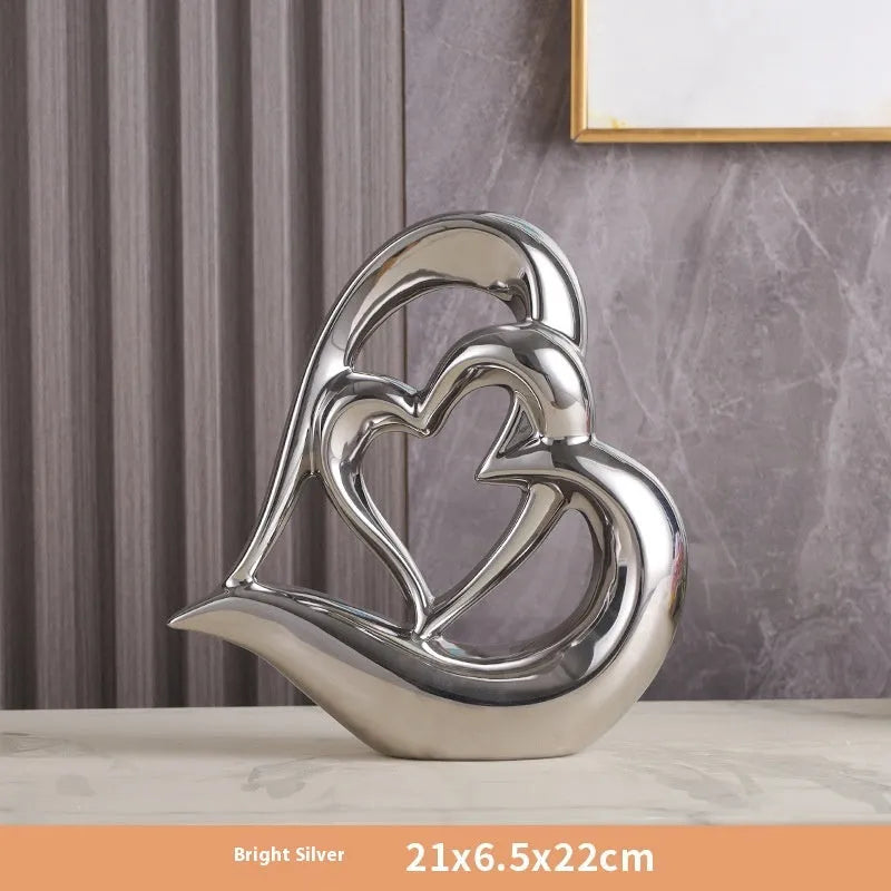 Modern white porcelain heart ornament in a choice of eight metallic and coloured finishes.