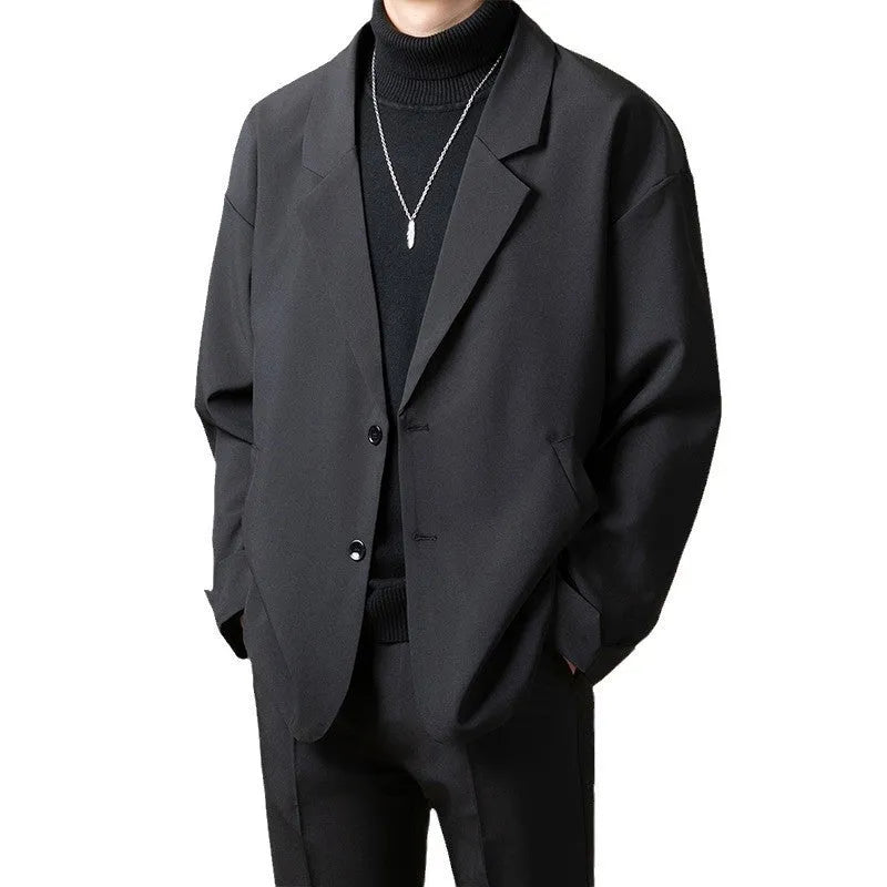 Man wearing a loose fit apricot coloured blazer jacket for light business or casual wear.