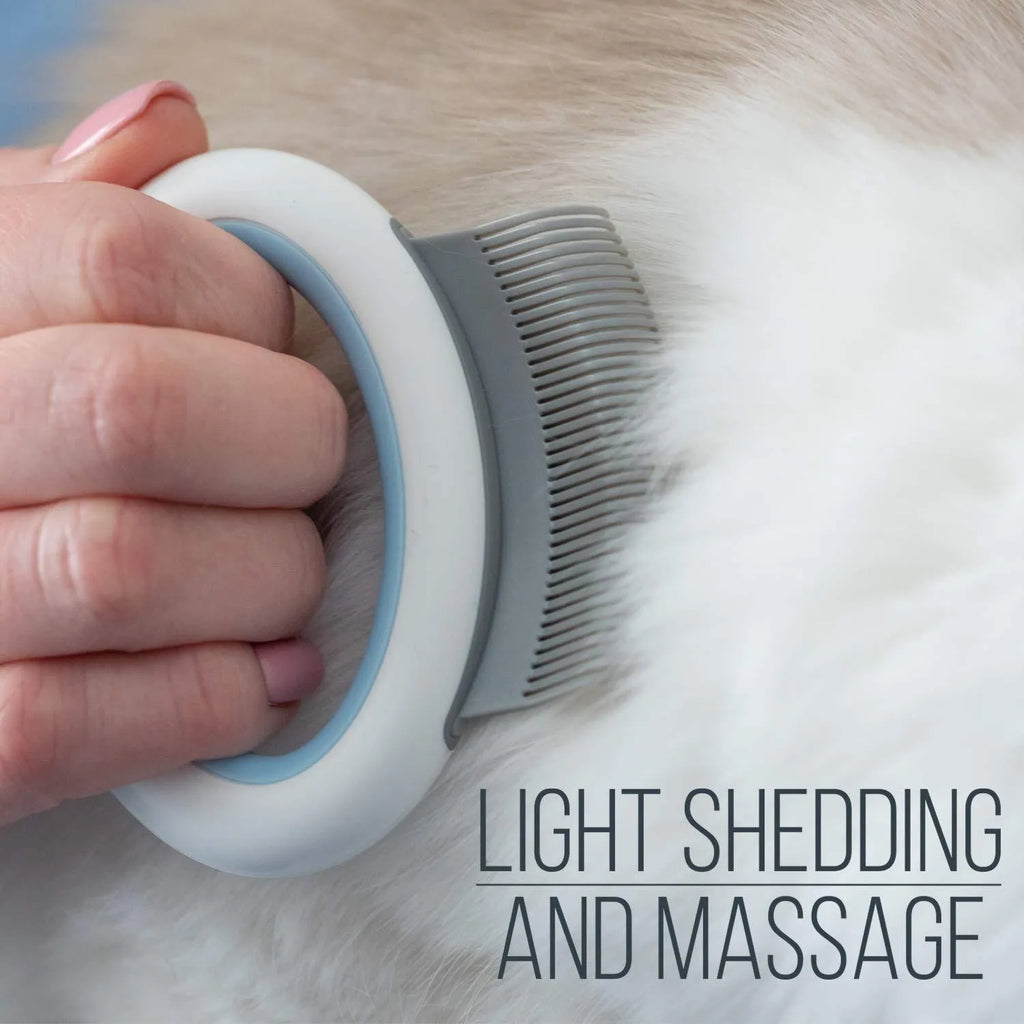 Blue pet deshedding comb with soft teeth and ergonomic plastic handle for cats and dogs.