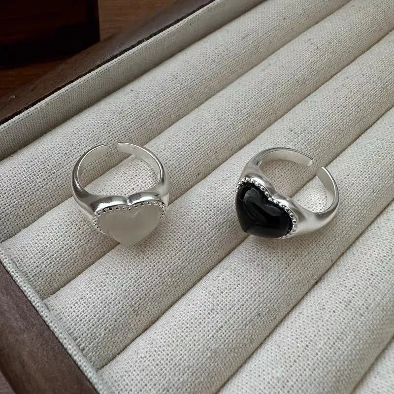 Adjustable sterling silver ring with heart-shaped black agate stone on open mouth design