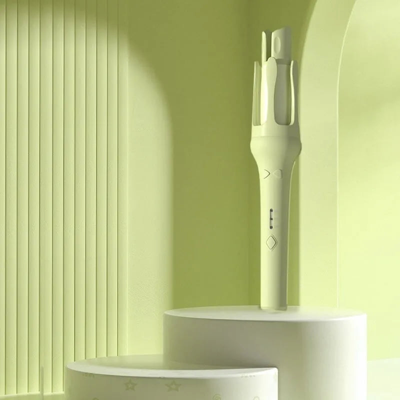 White and pink automatic hair curler with 32mm rotating barrel on a table