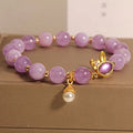 Purplish red jade rabbit hare head charm on a crystal Mori style bracelet.