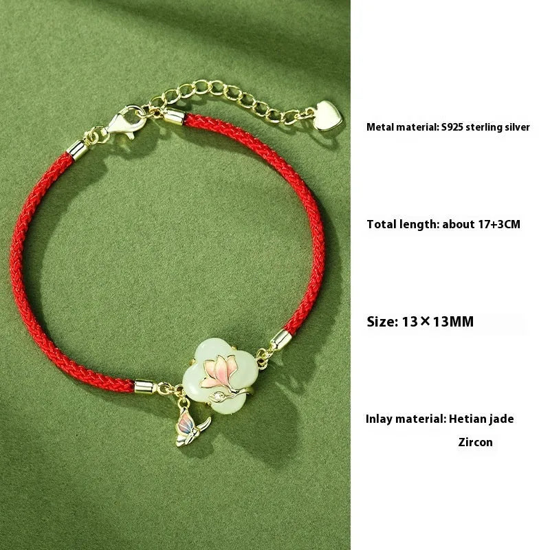 S925 sterling silver magnolia necklace, bracelet, and ear studs set with inlaid Hetian jade in a New Chinese floral style.