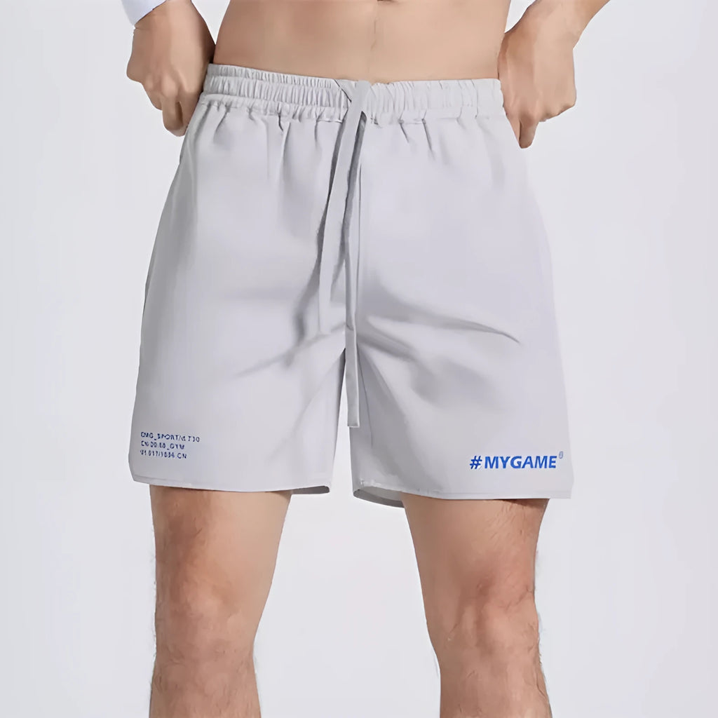Men's navy blue training shorts with moisture-wicking fabric on a grey background.