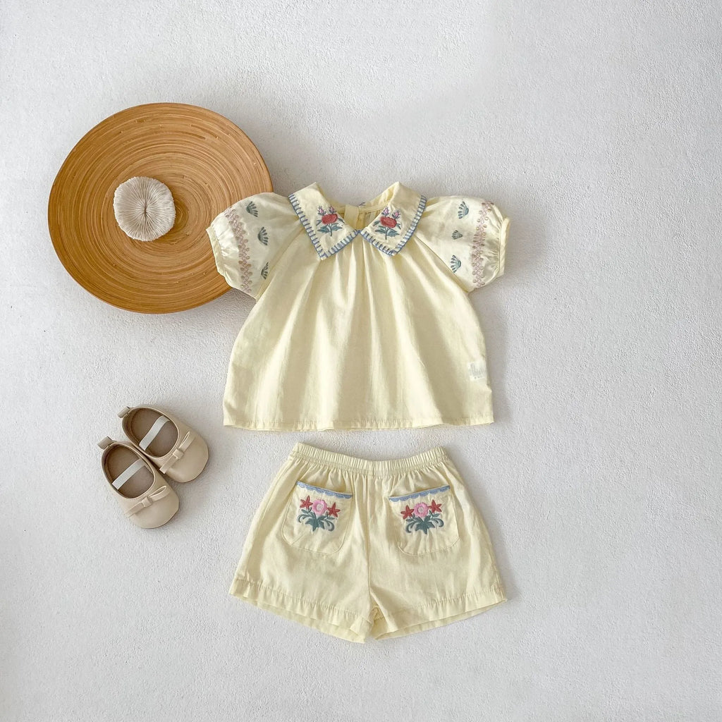 Baby girl yellow cotton suit with flower embroidery on the shirt and matching shorts