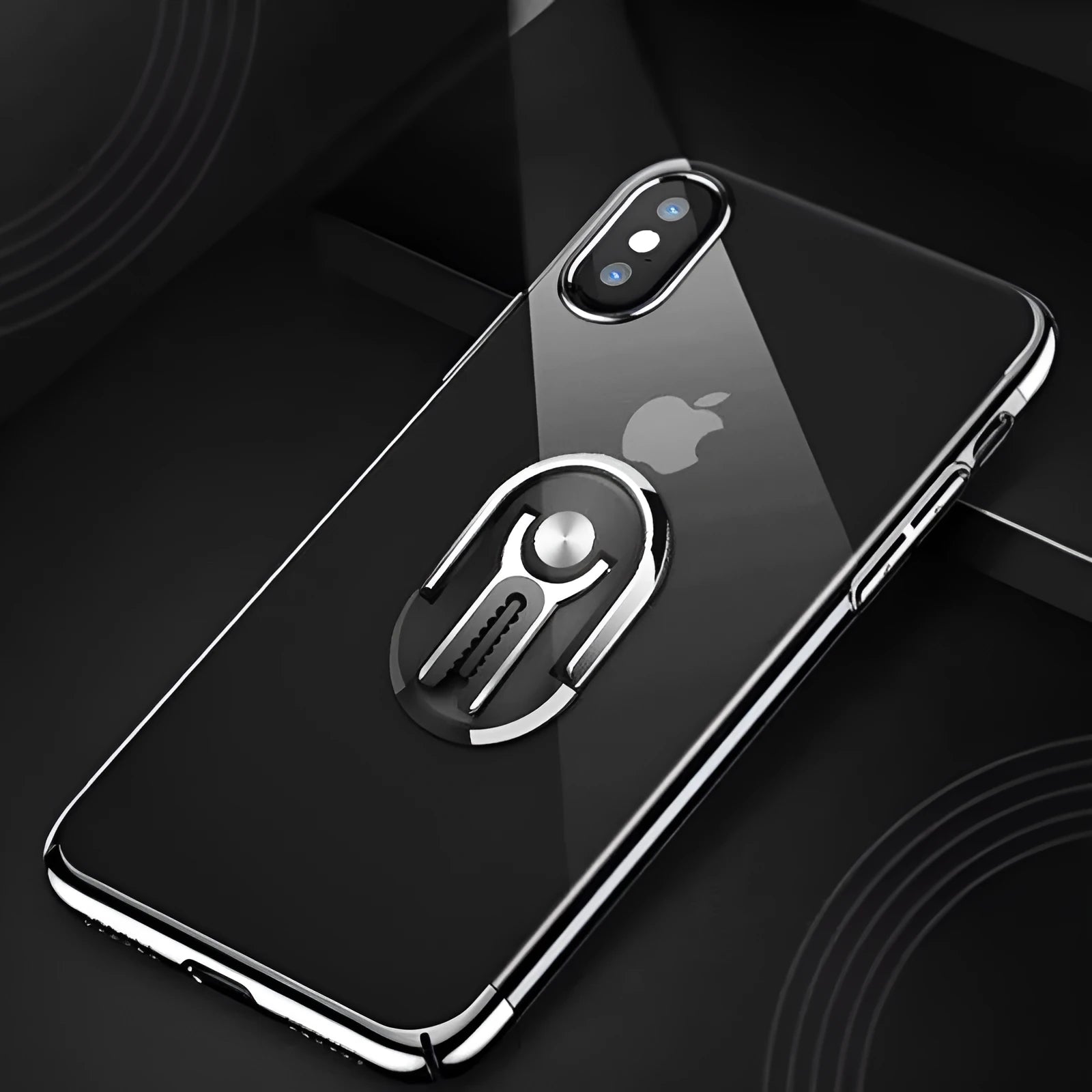 Universal black car phone bracket with 360-degree rotating ring and adhesive base mounted on a dashboard