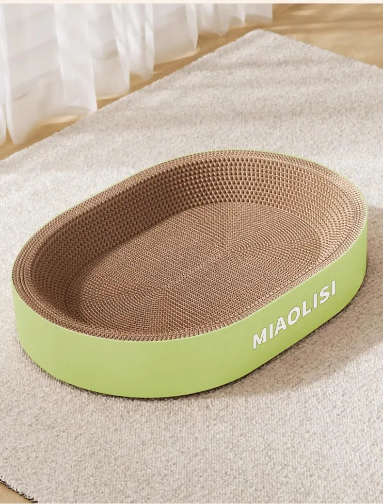 Green oval corrugated paper cat scratch board and lounge nest, 55 cm in diameter