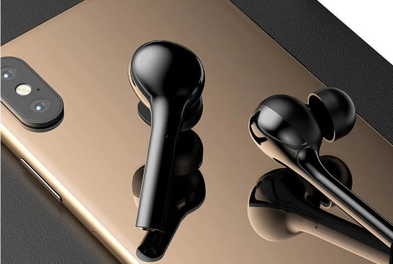Black and white touch control wireless earbuds with a charging case on a white background