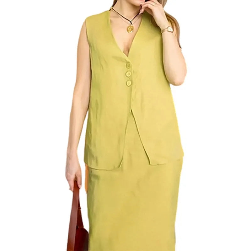 A woman modelling a blue sleeveless vest and matching long skirt from a casual two-piece suit.