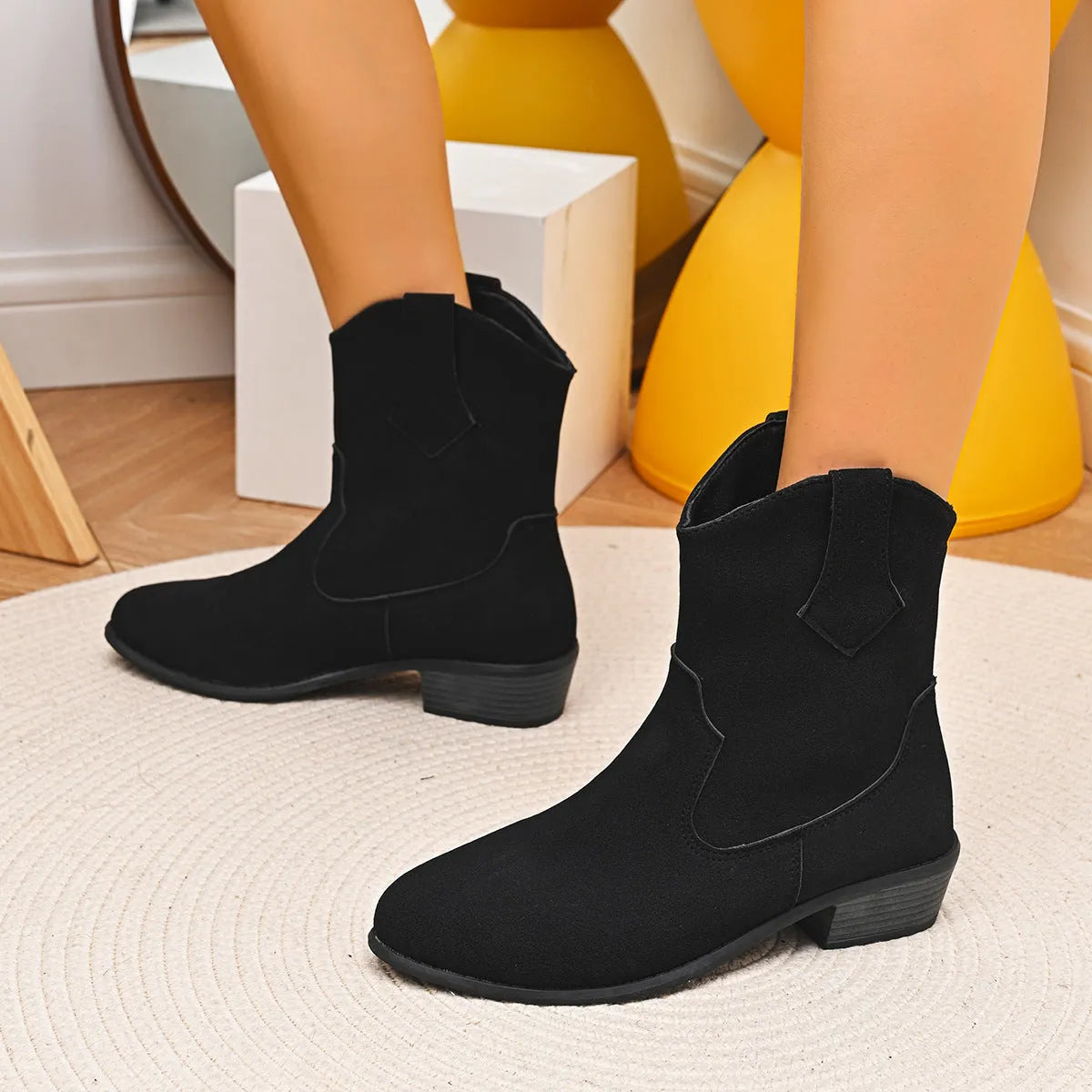 Pointed British style mid heel boots in black PU upper with rubber sole