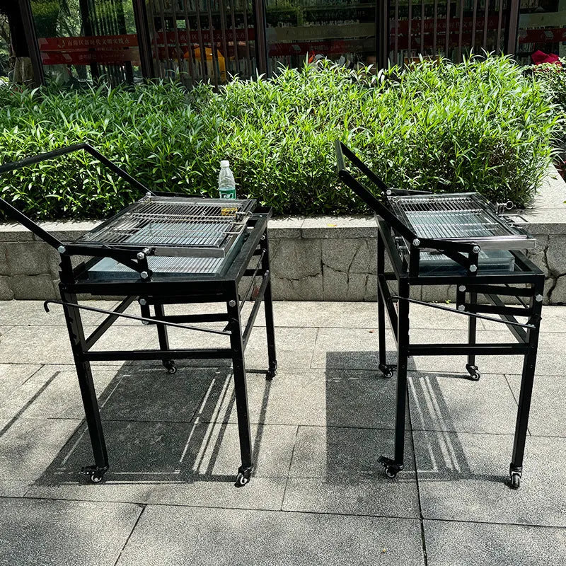 Large foldable portable charcoal BBQ stove with a detachable grill for outdoor cooking.
