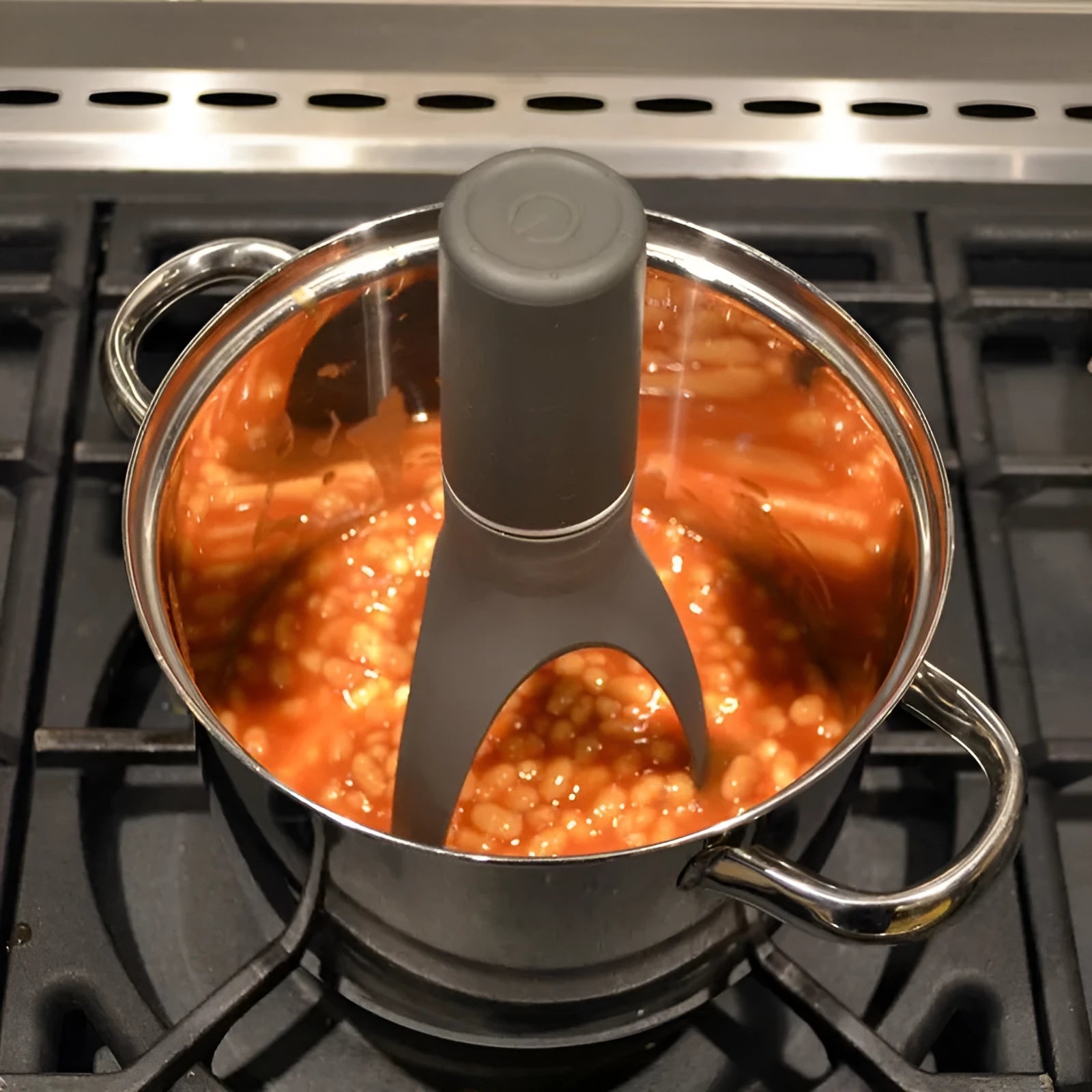 Green automatic cooking mixer device for stirring sauces and soups in pot