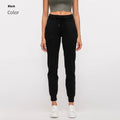 Women's high-waist yoga pants with a drawstring waist in a blue colour, laid flat.