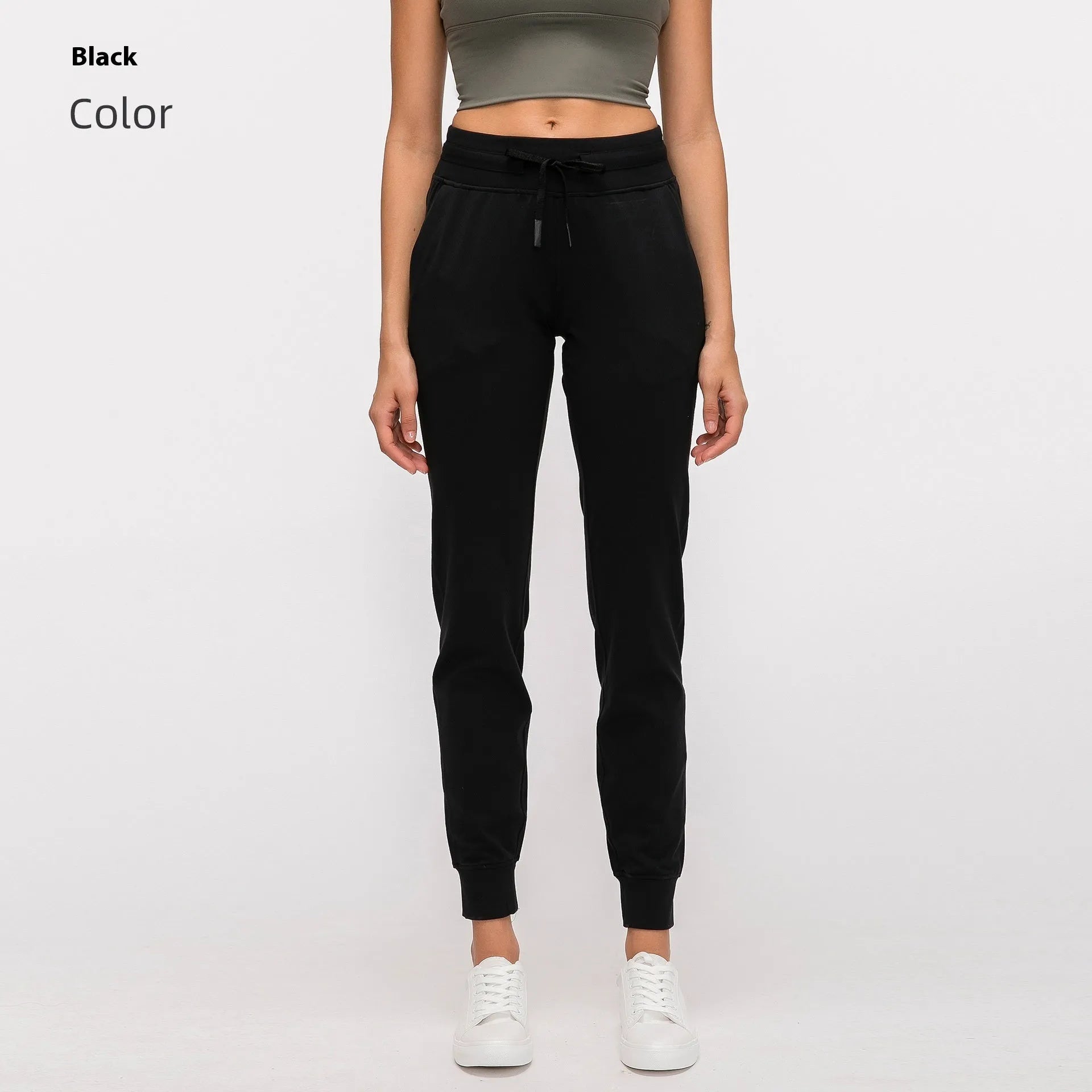 Women's high-waist yoga pants with a drawstring waist in a blue colour, laid flat.