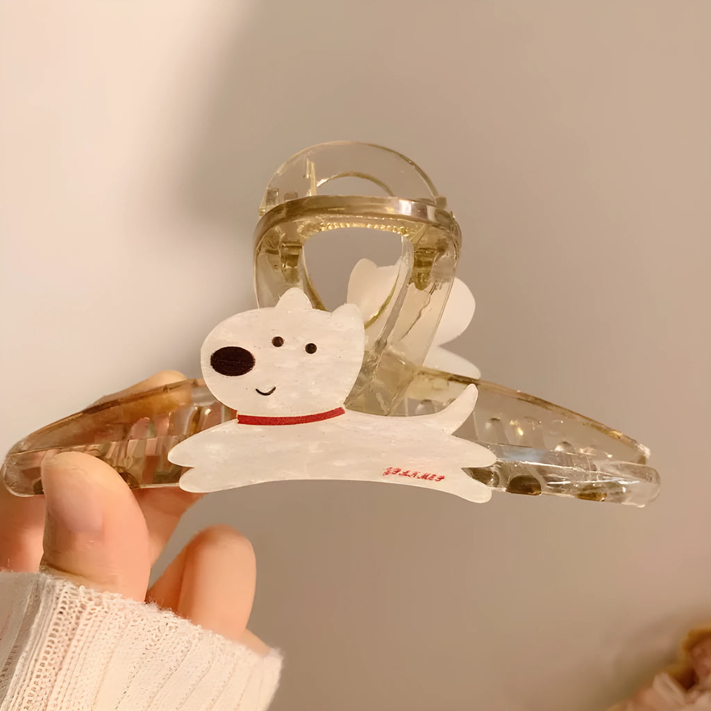 Beige and brown cartoon puppy-shaped hair grip barrettes on a white background.
