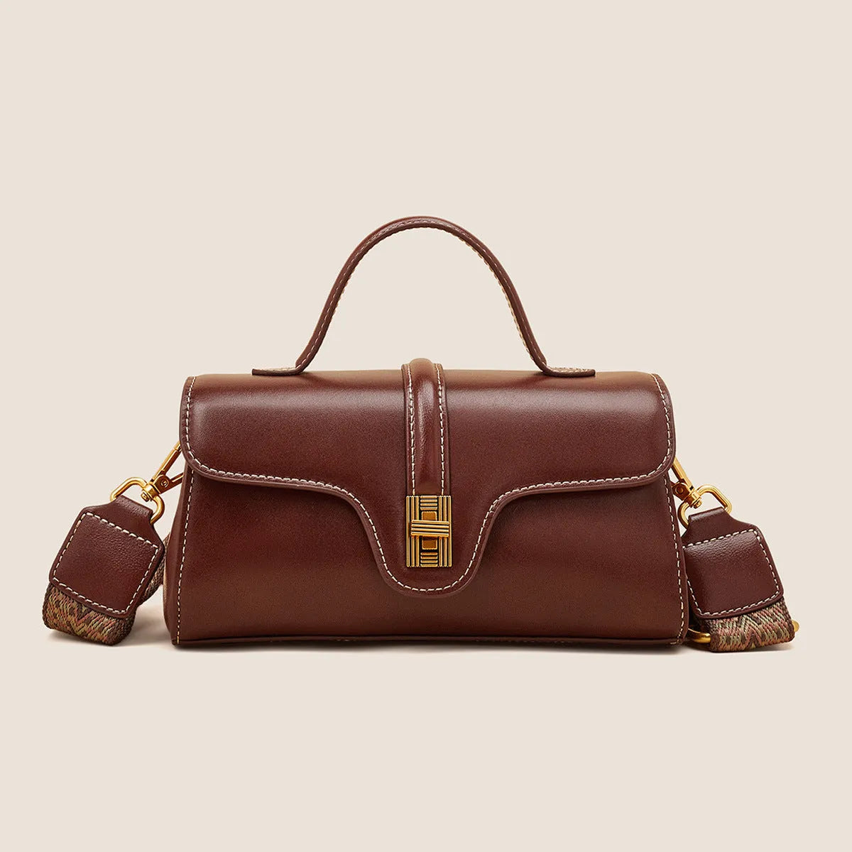 Niche retro Cambridge messenger bag in brown cow leather with lock detail and clamshell opening