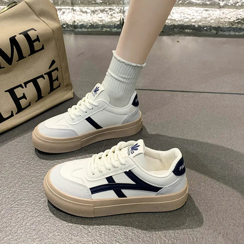 Low-top brown and blue casual board shoes with patent leather upper and flat rubber sole