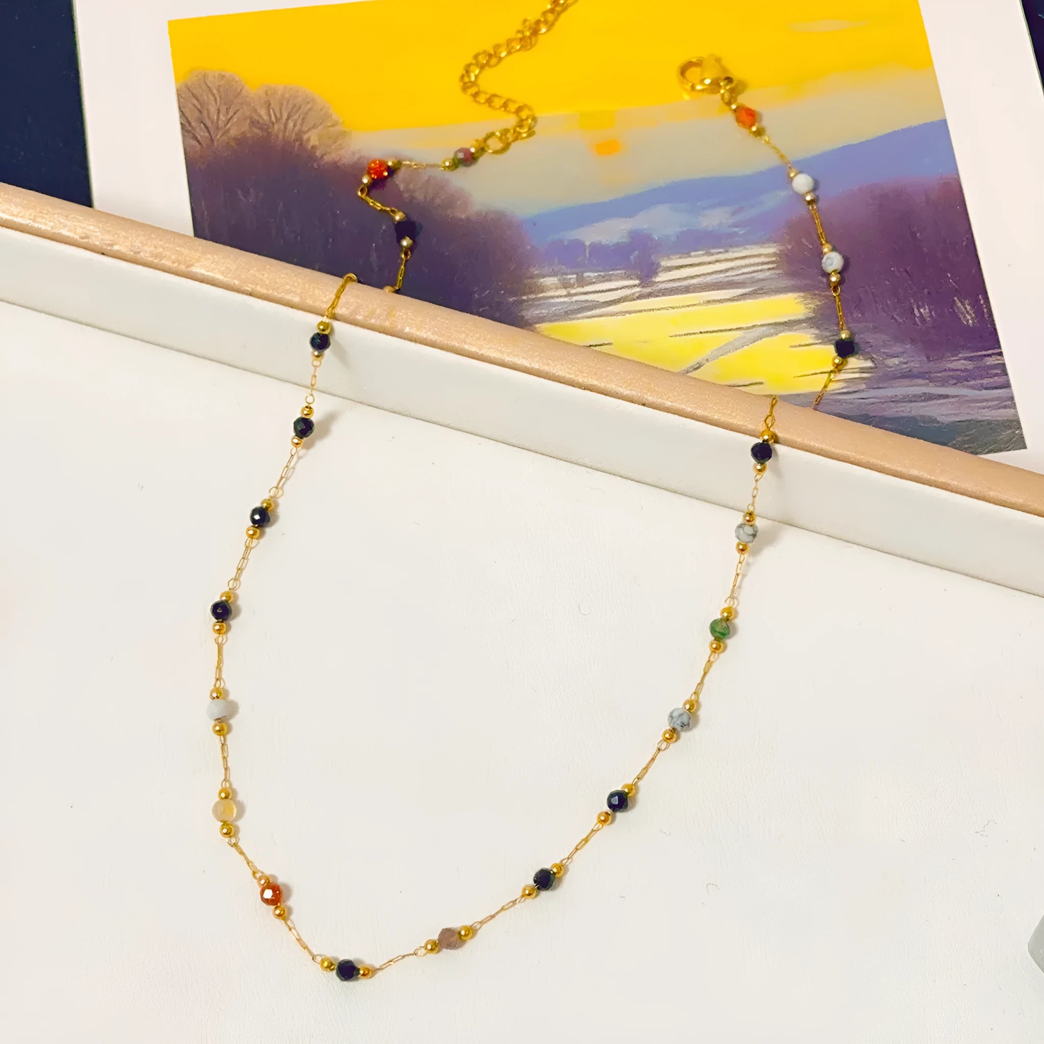 Gold electroplated titanium steel necklace with natural stone pendant on O-ring chain