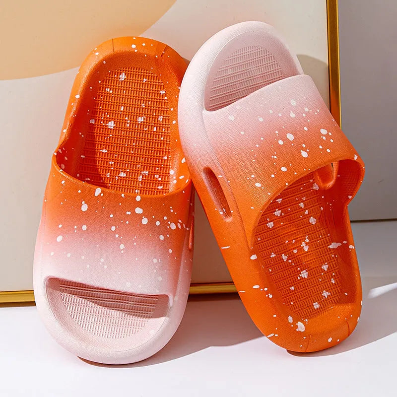 Blue gradient PVC slippers for children on a white background showing the non-slip sole pattern.