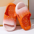 Blue gradient PVC slippers for children on a white background showing the non-slip sole pattern.