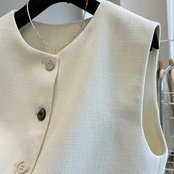 Women's sleeveless bandage dress vest in polyester with round neck, shown in milky white and black colours