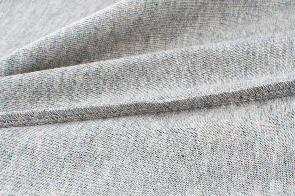 Children's light grey cartoon print cotton T-shirt with short sleeves and round neck.