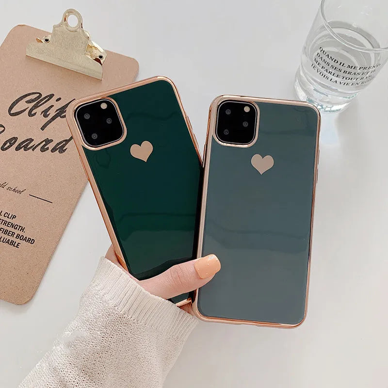 Luxury plating love solid colour TPU back cover case for iPhone on a table.