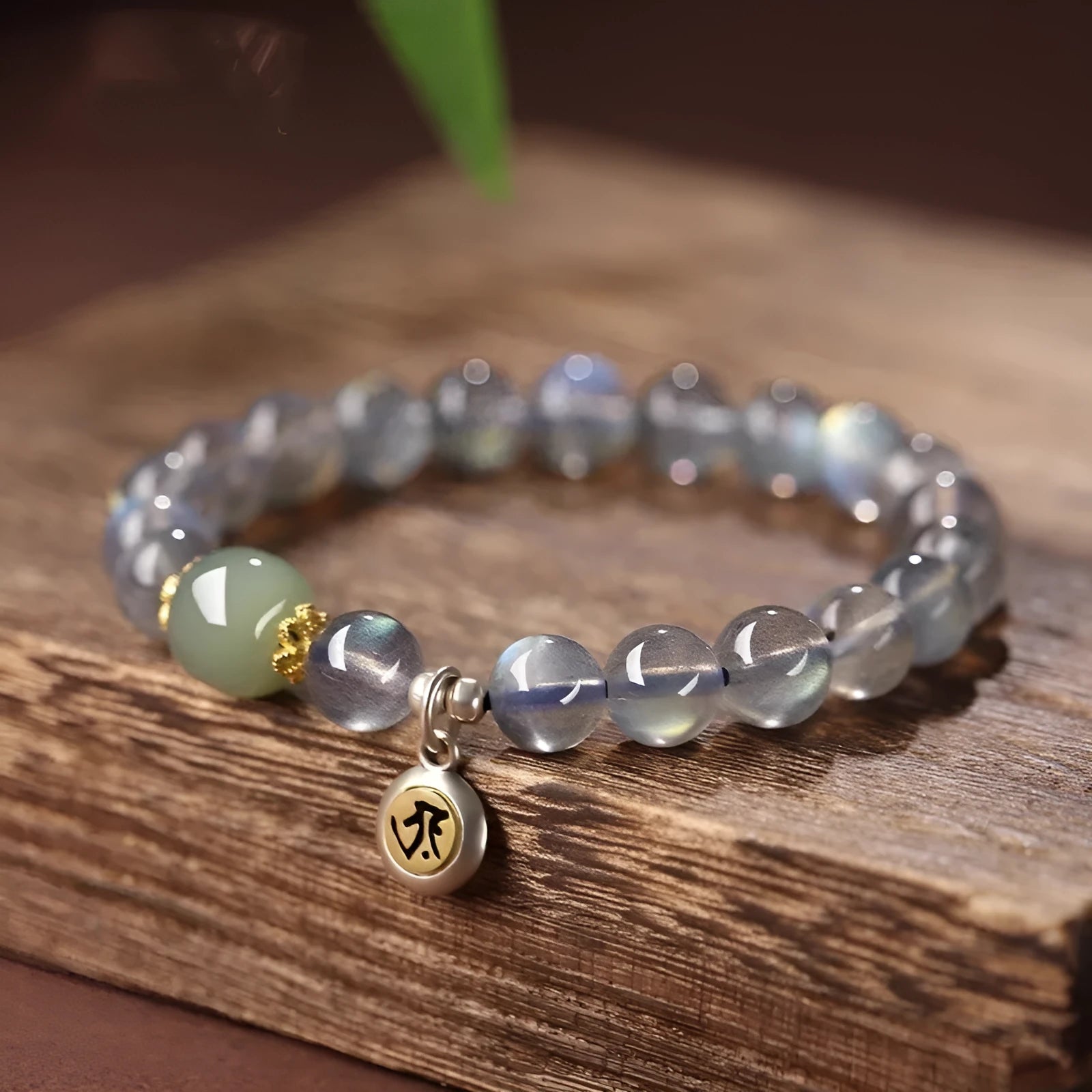 Birth Buddha Beads moonstone bracelet with 8mm beads featuring Thousand-Hand Kwan-yin mouse design